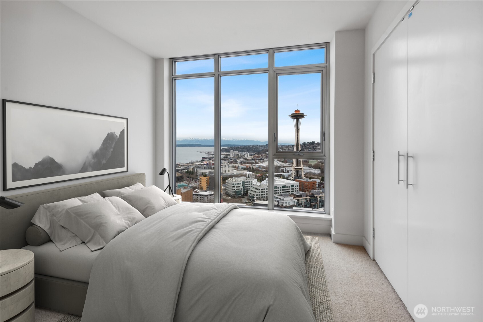 583 Battery Street, Unit 3103N Seattle, WA 98121 - Photo 7 of 39 a bedroom with a bed a mirror and a window