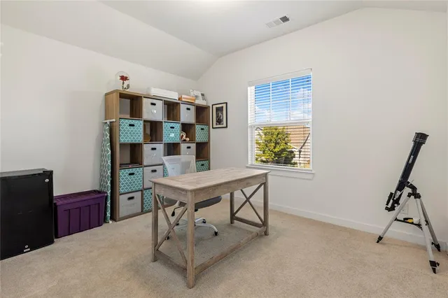 a view of a workspace with furniture