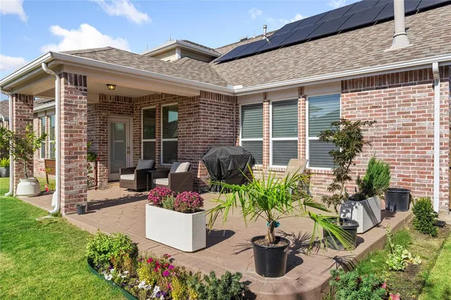 a front view of a house with sitting area