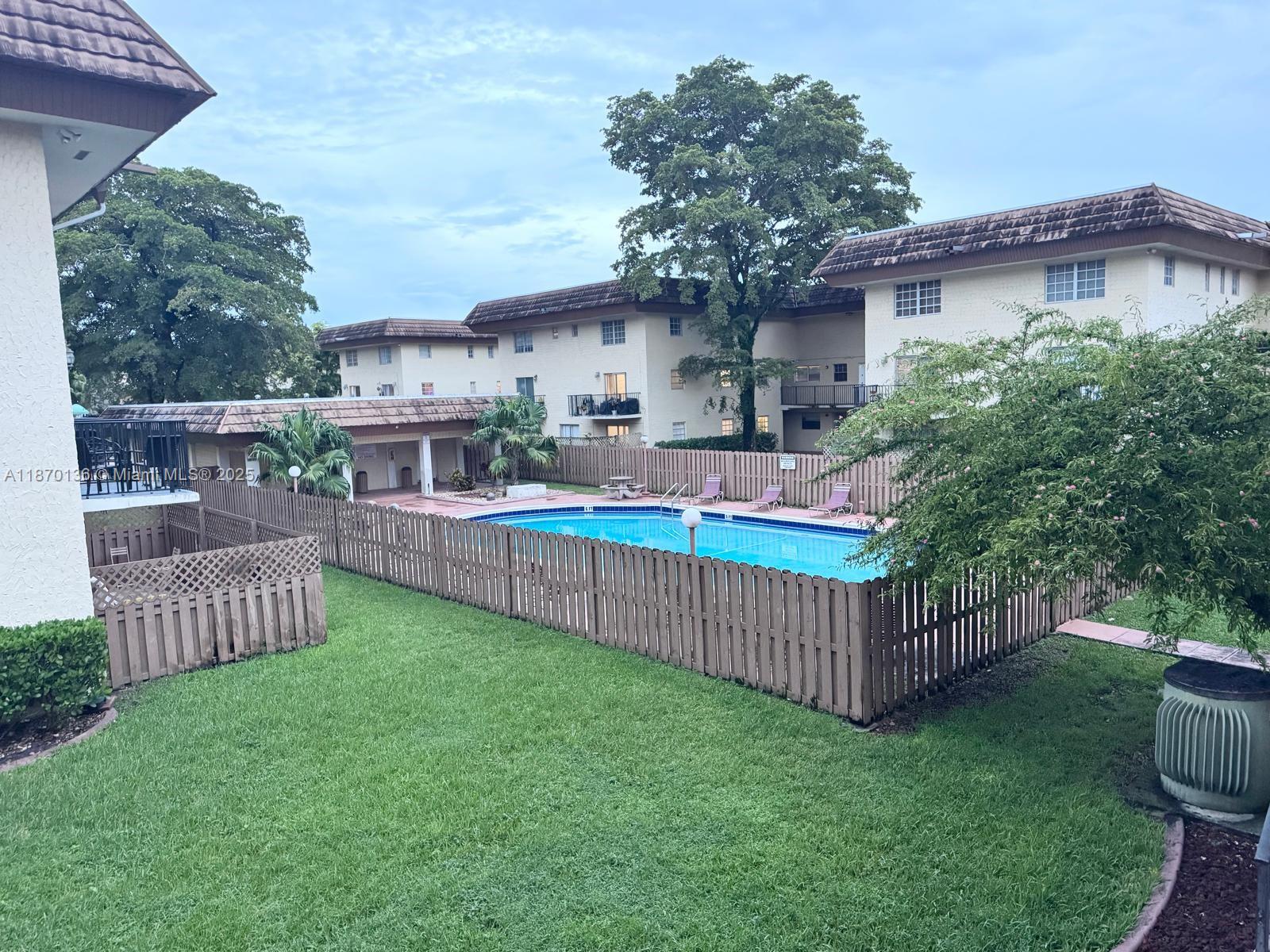 8500 Southwest 109th Avenue, Unit 6118 Miami, FL 33173 - Photo 5 of 15 a view of a house with a yard and deck