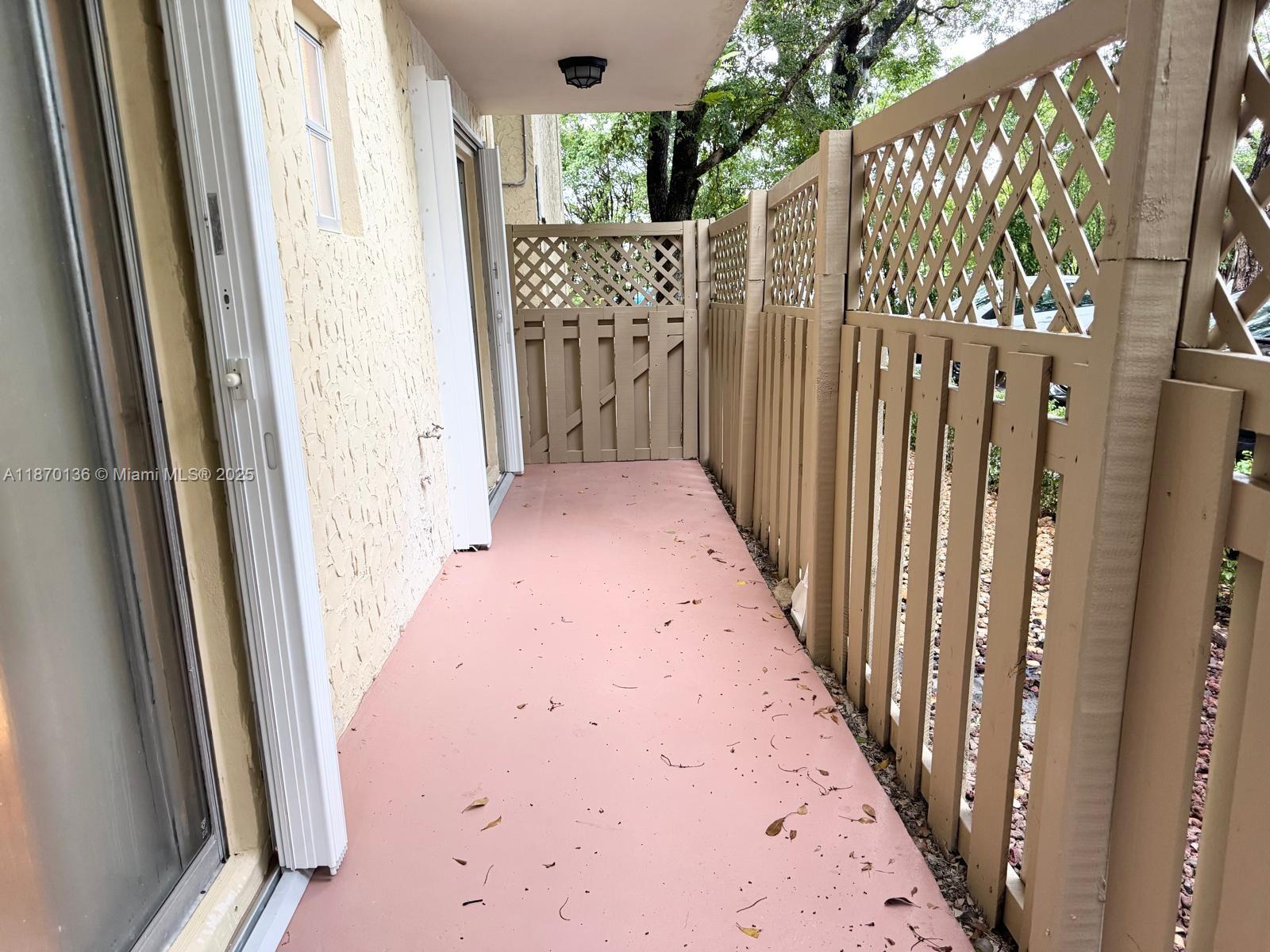 8500 Southwest 109th Avenue, Unit 6118 Miami, FL 33173 - Photo 6 of 15 a view of a hallway with wooden door and stairs