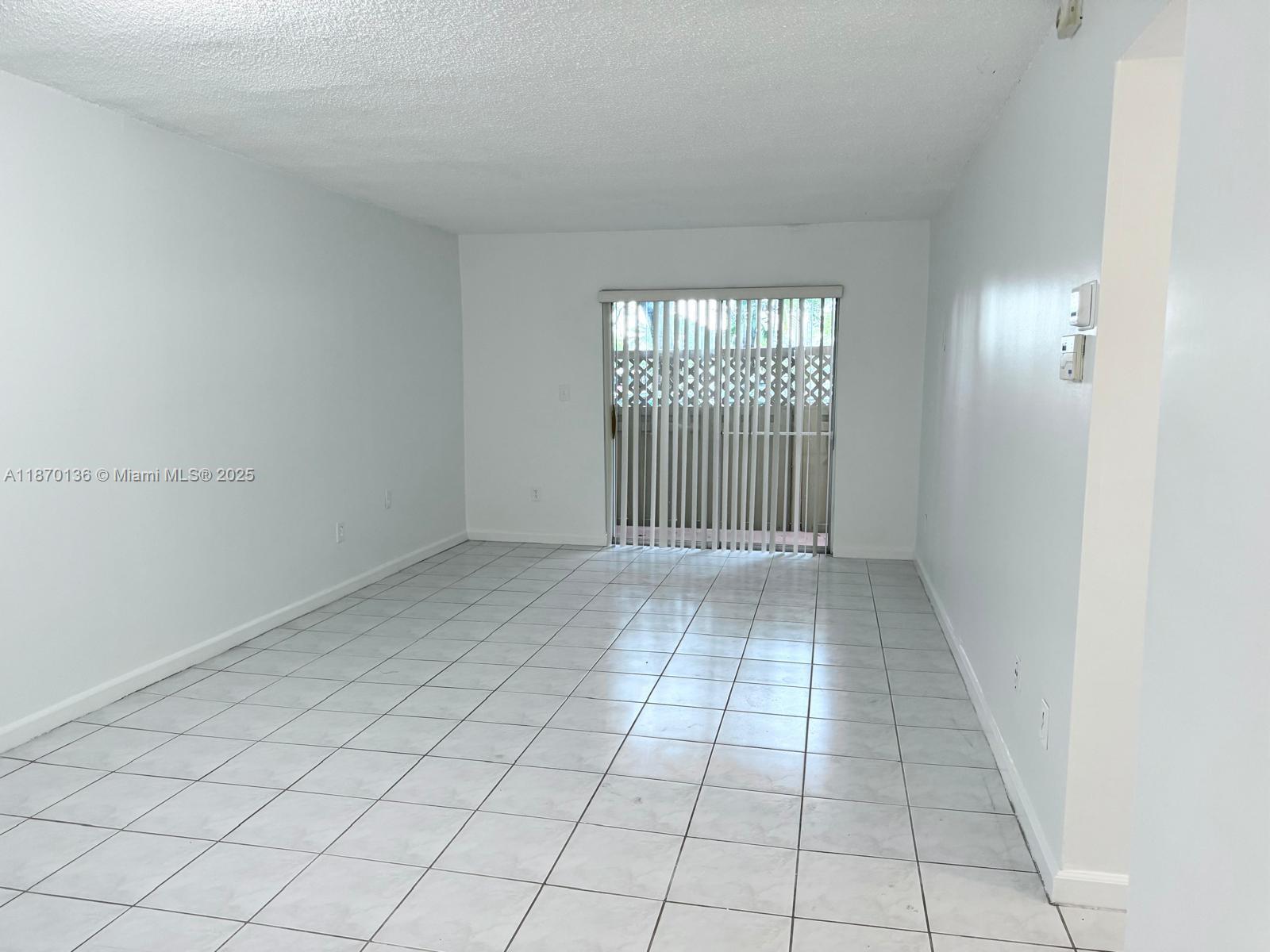 8500 Southwest 109th Avenue, Unit 6118 Miami, FL 33173 - Photo 7 of 15 an empty room with windows