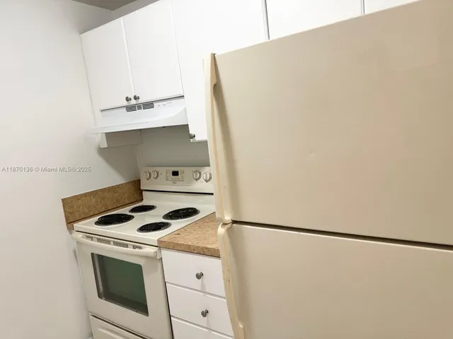 a view of storage and utility room with washer and dryer