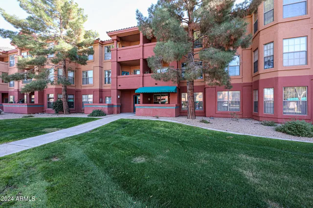 a view of a building with a yard