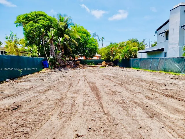a view of a backyard of the house