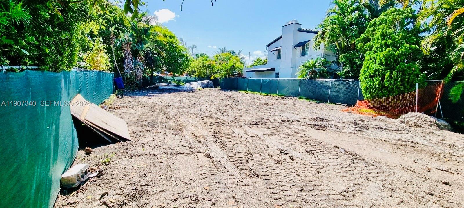 9116 Abbott Avenue Surfside, FL 33154 - Photo 5 of 6 a view of a backyard with a tree