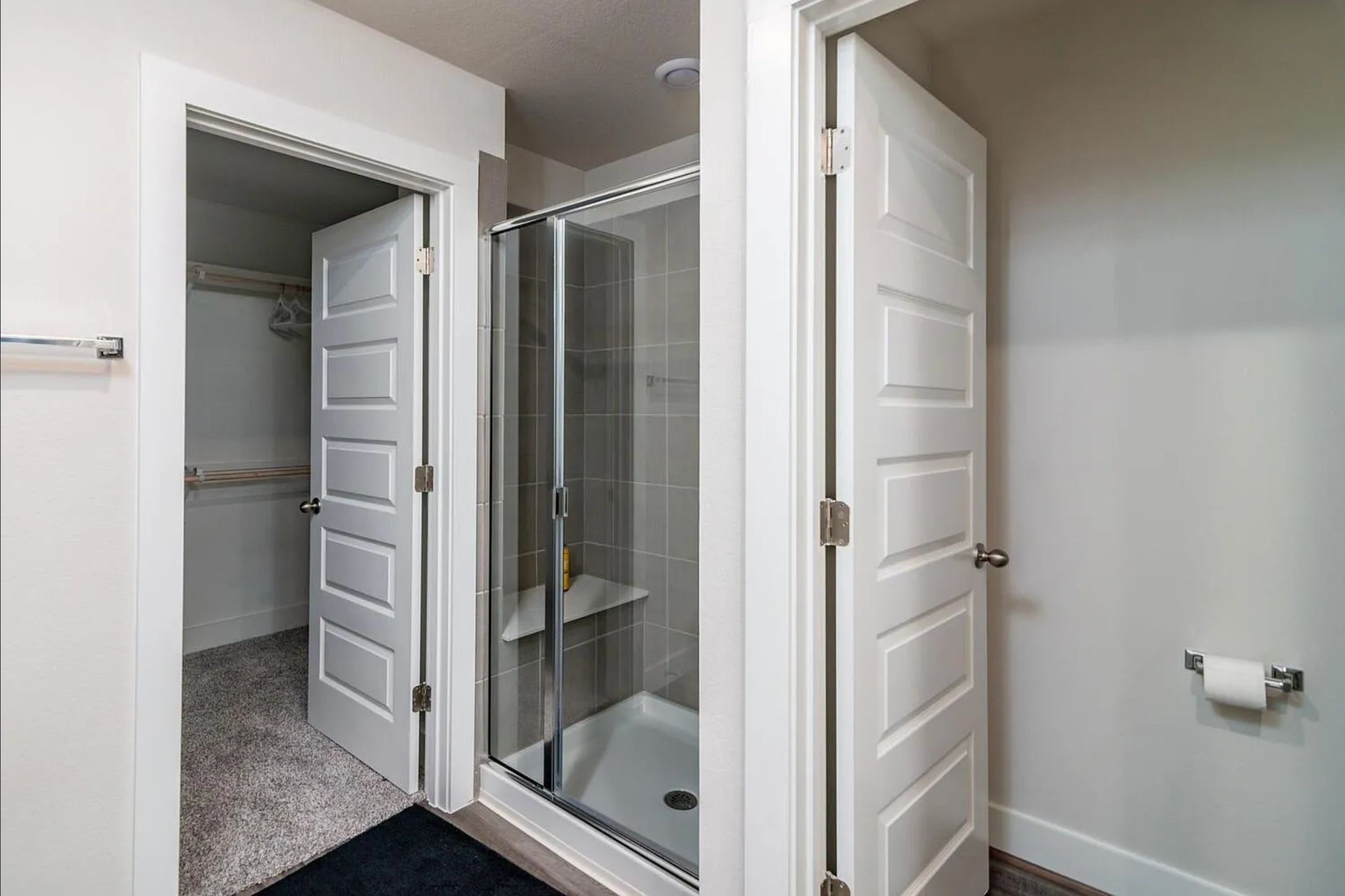 7501 Travertine Spring Drive Austin, TX 78744 - Photo 18 of 28 Contemporary walk-in shower with glass enclosure and tiled walls