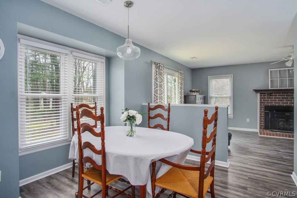 4404 Rabbit Foot Place Chesterfield, VA 23236 - Photo 13 of 32 a view of a dining room with furniture window and wooden floor