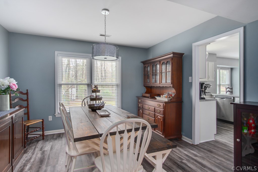 4404 Rabbit Foot Place Chesterfield, VA 23236 - Photo 8 of 32 a view of a dining room with furniture window and wooden floor