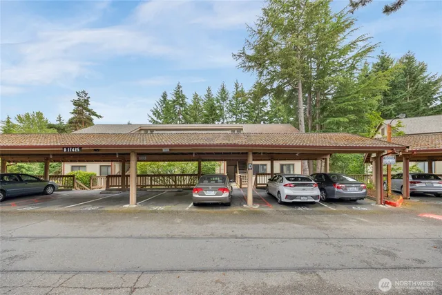 a view of a house with more windows and wooden fence