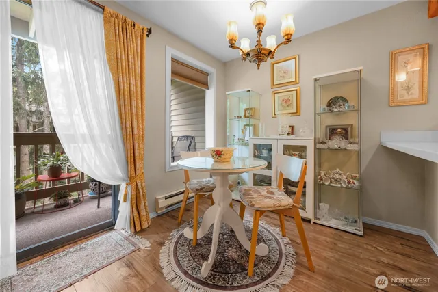 a living room with furniture a table and a chandelier