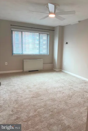 an empty room with a empty space and windows