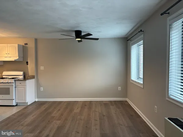 a view of a kitchen with a sink dishwasher and a window