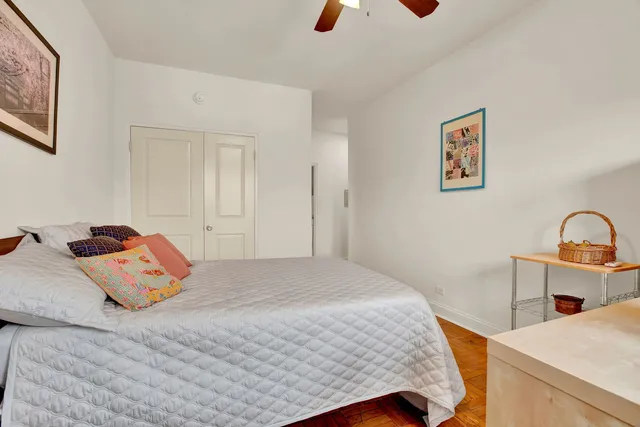 a bedroom with a bed and with a dresser