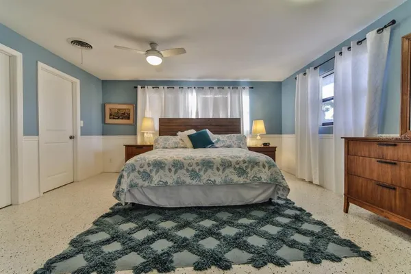 a bedroom with a bed and a cabinets