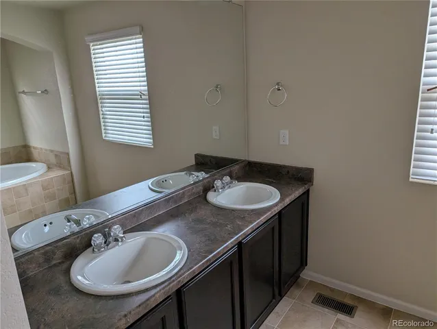 a bathroom with a shower and a sink