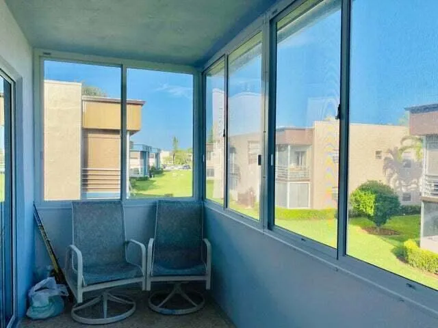 a kitchen with a white cabinets and a stove