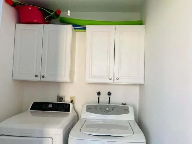 a bathroom with a sink a toilet and shower curtain
