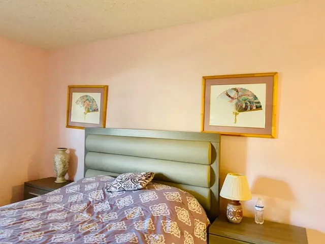 a room with a flat screen tv and a window