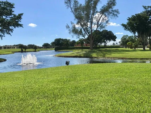 a view of a lake with a yard