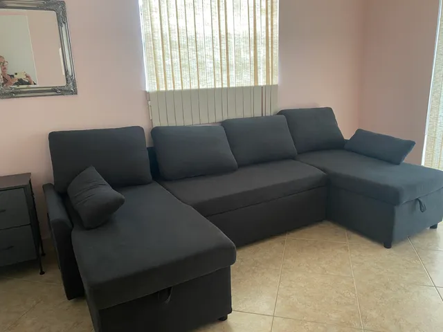 a living room with furniture and a window