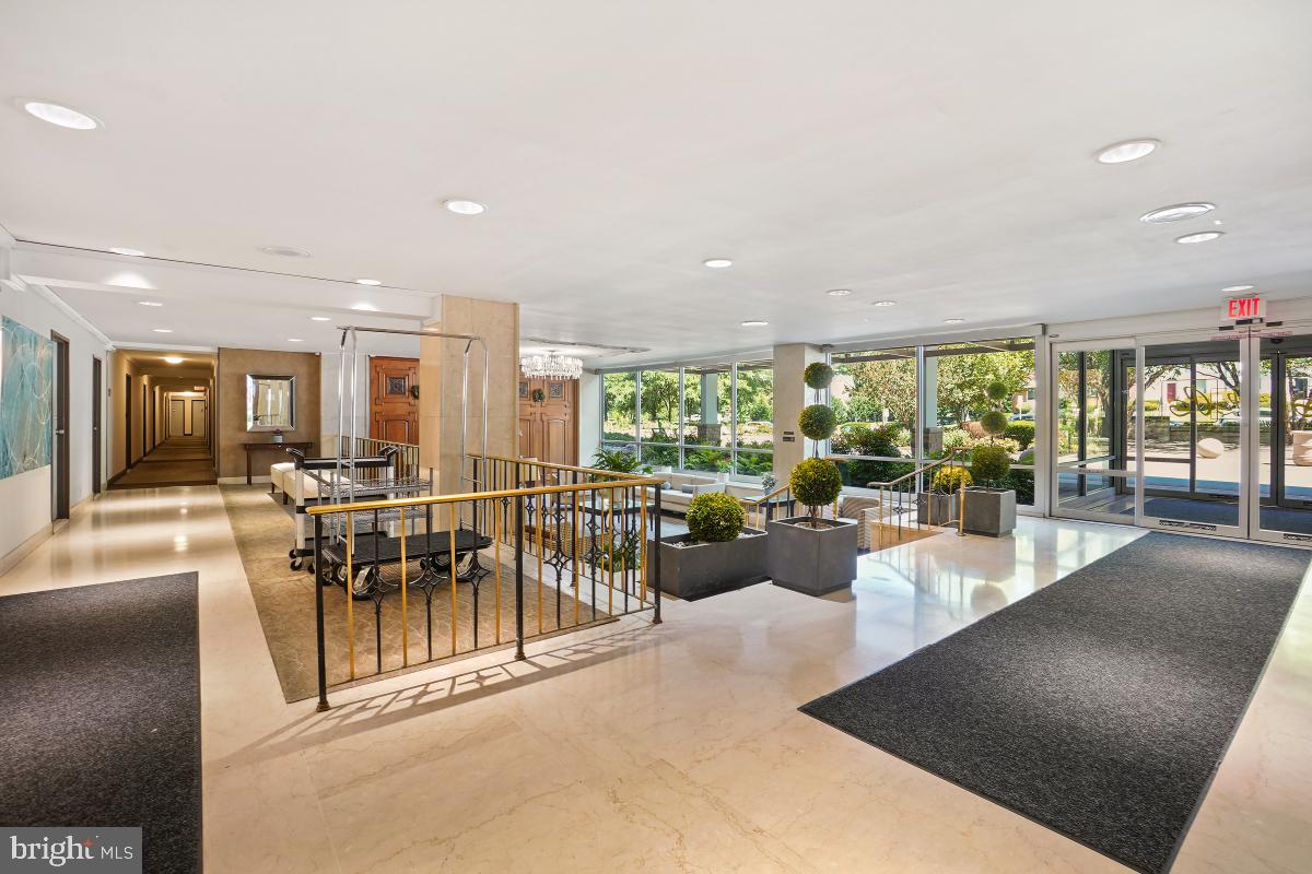 1900 Lyttonsville Road, Unit 1101 Silver Spring, MD 20910 - Photo 20 of 24 a view of a dining room with furniture water view and a floor to ceiling window