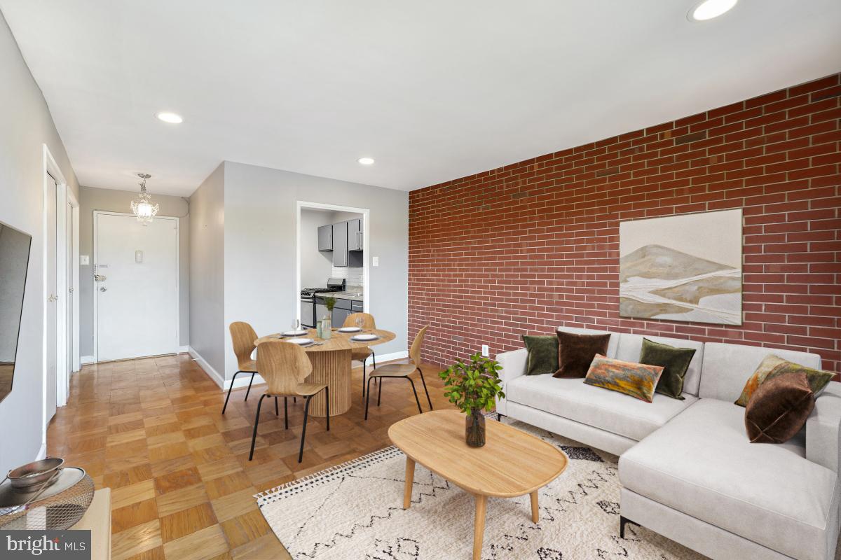 1900 Lyttonsville Road, Unit 1101 Silver Spring, MD 20910 - Photo 4 of 24 a living room with furniture and wooden floor