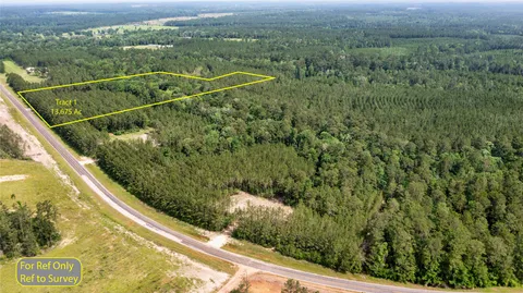 a view of a balcony with yard