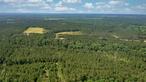 a view of a green field with lots of green space in it