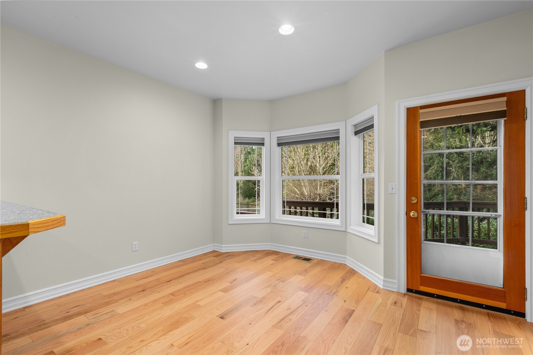13796 Seaview Way Anacortes, WA 98221 - Photo 15 of 39 an empty room with wooden floor and windows
