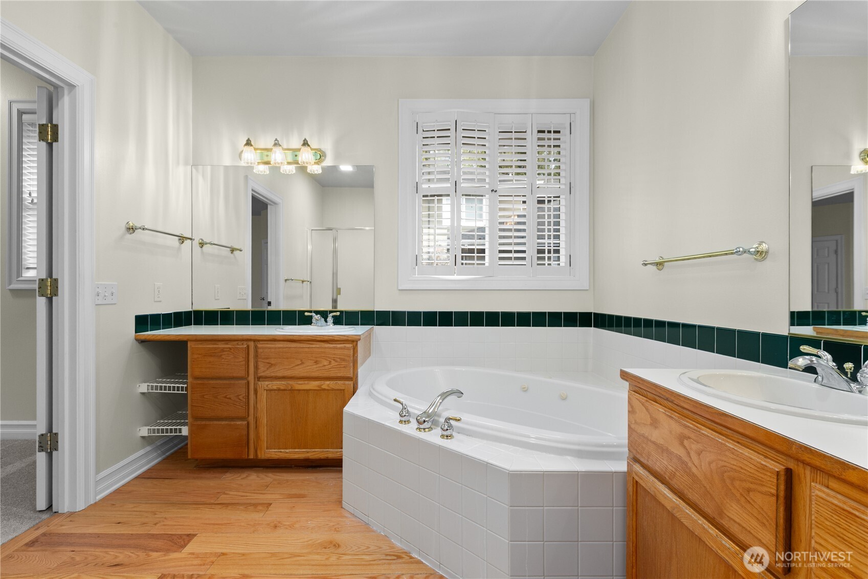 13796 Seaview Way Anacortes, WA 98221 - Photo 19 of 39 a bathroom with a tub sink and mirror