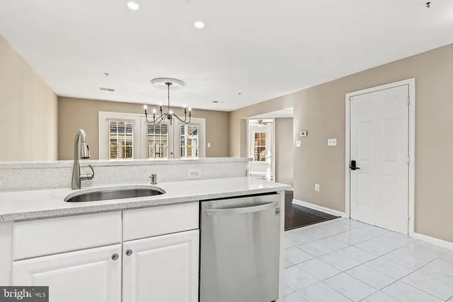a kitchen with a sink and cabinets