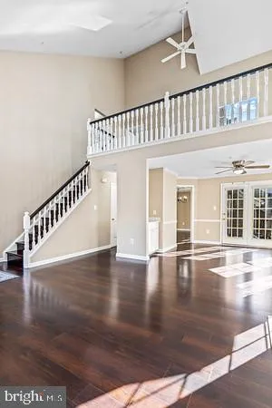 a view of an entryway with wooden floor