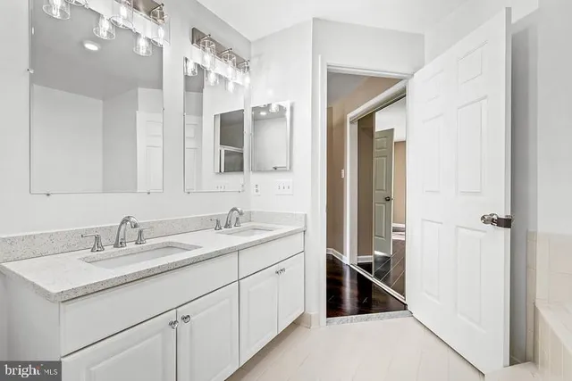 a en suite bathroom with a sink and a mirror