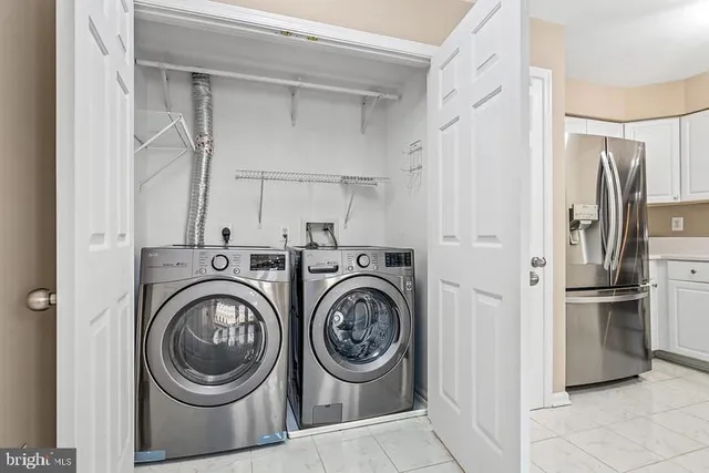 a view of bathroom with washer and dryer