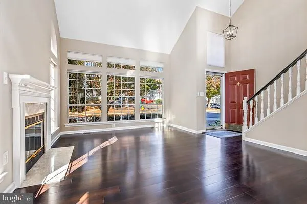 a view of an entryway with wooden floor