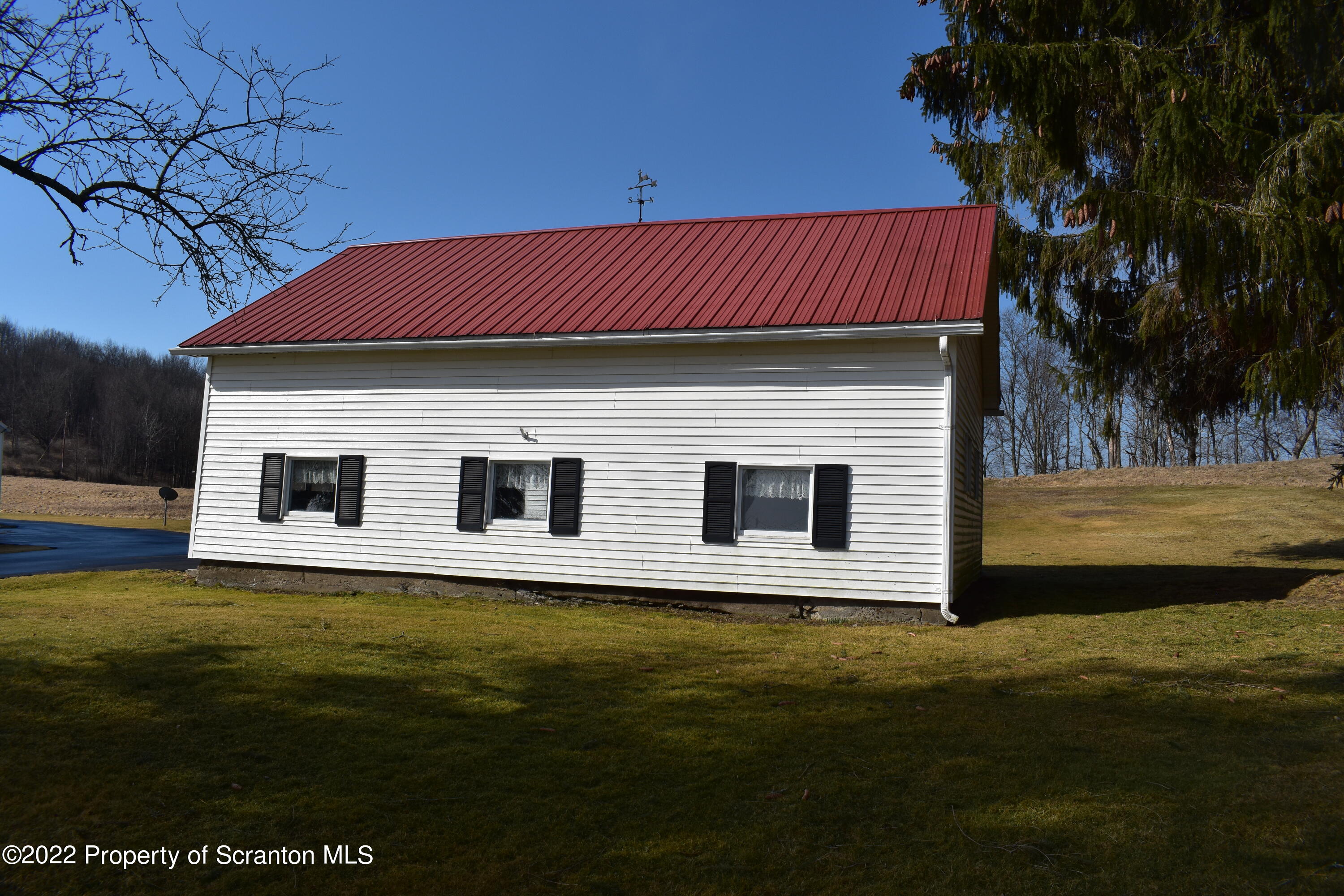 1815 Vandermark Road Montrose, PA 18801 - Photo 50 of 62 a house with garden in front of it