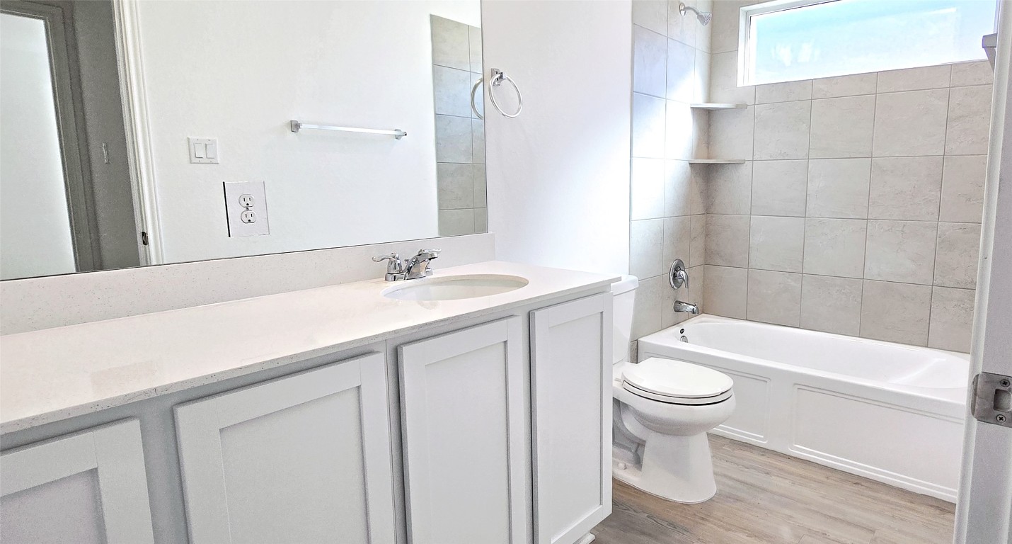 1637 Chapel Ranch Road Georgetown, TX 78628 - Photo 12 of 14 a bathroom with a sink a toilet and bathtub