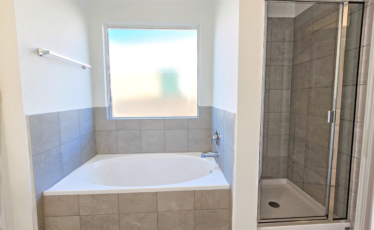 1637 Chapel Ranch Road Georgetown, TX 78628 - Photo 13 of 14 a bathroom with a bath tub and shower