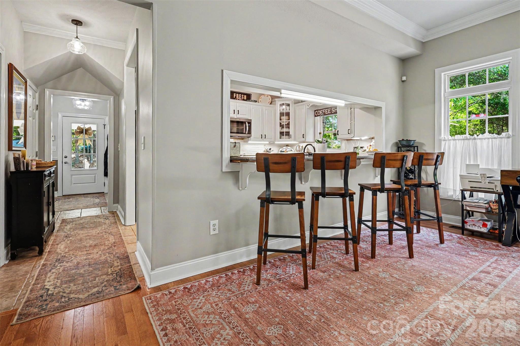 4037 Old Williamston Road Belton, SC 29627 - Photo 19 of 41 a view of a dining room with furniture and a potted plant