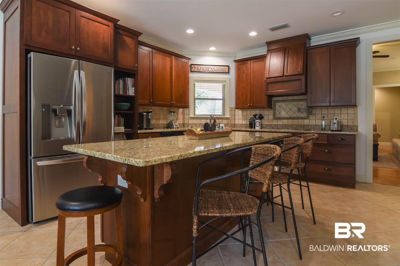 10948 Niblick Loop Fairhope, AL 36532 - Photo 17 of 30 Granite counters, custom cabinets