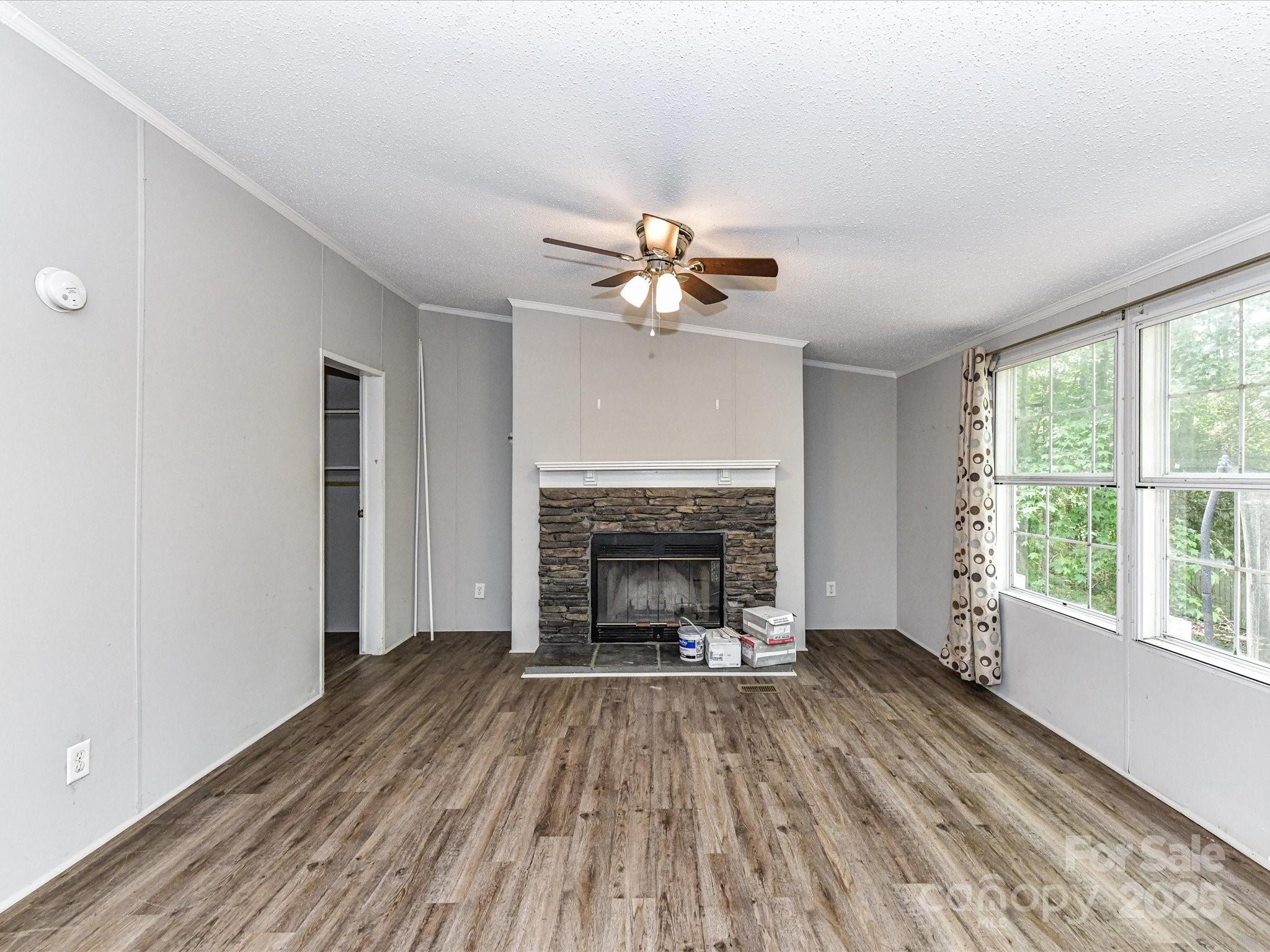 615 Hawley Road McConnells, SC 29726 - Photo 13 of 47 wooden floor fireplace and windows in an empty room