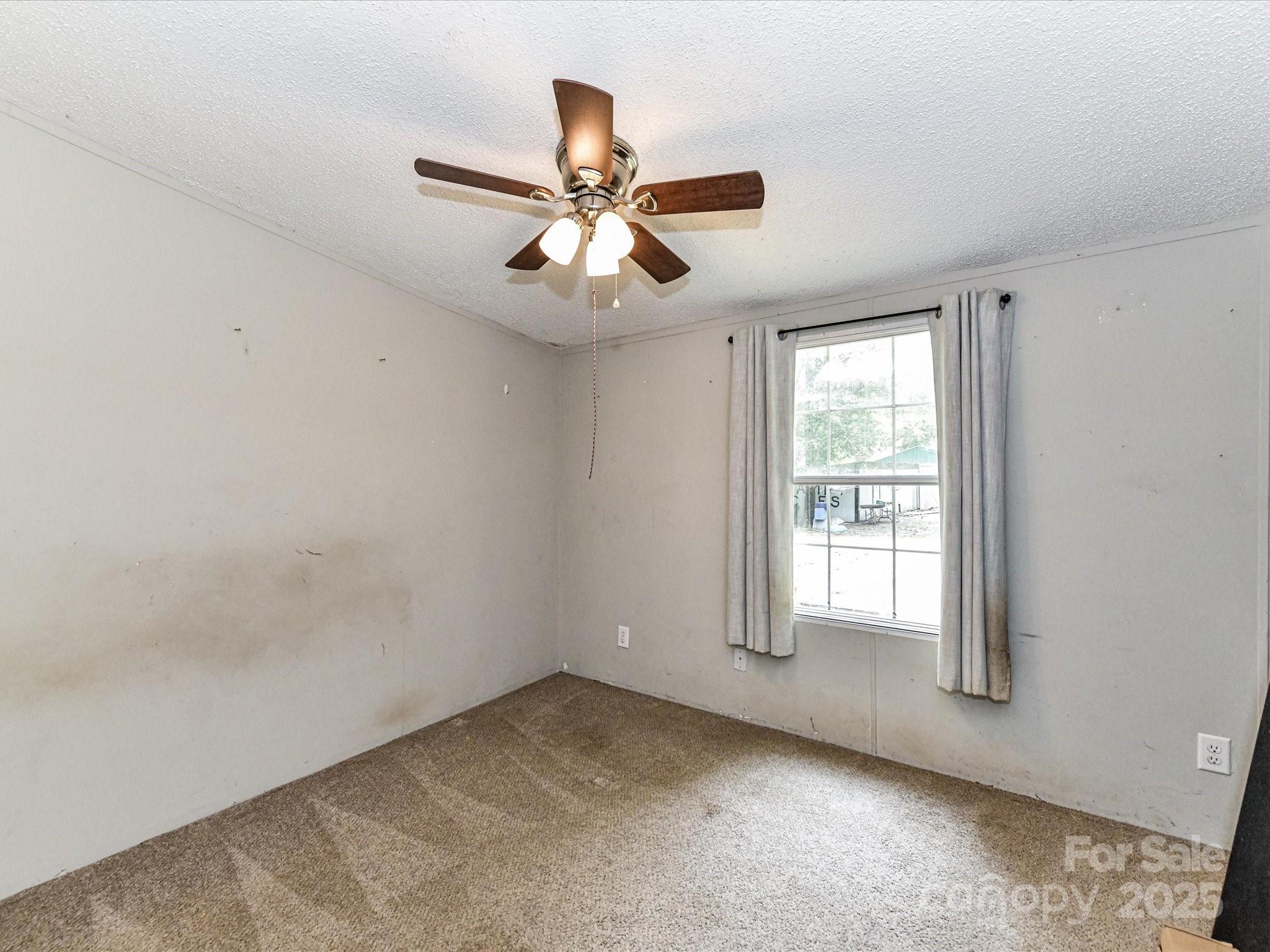 615 Hawley Road McConnells, SC 29726 - Photo 22 of 47 an empty room with windows and fan