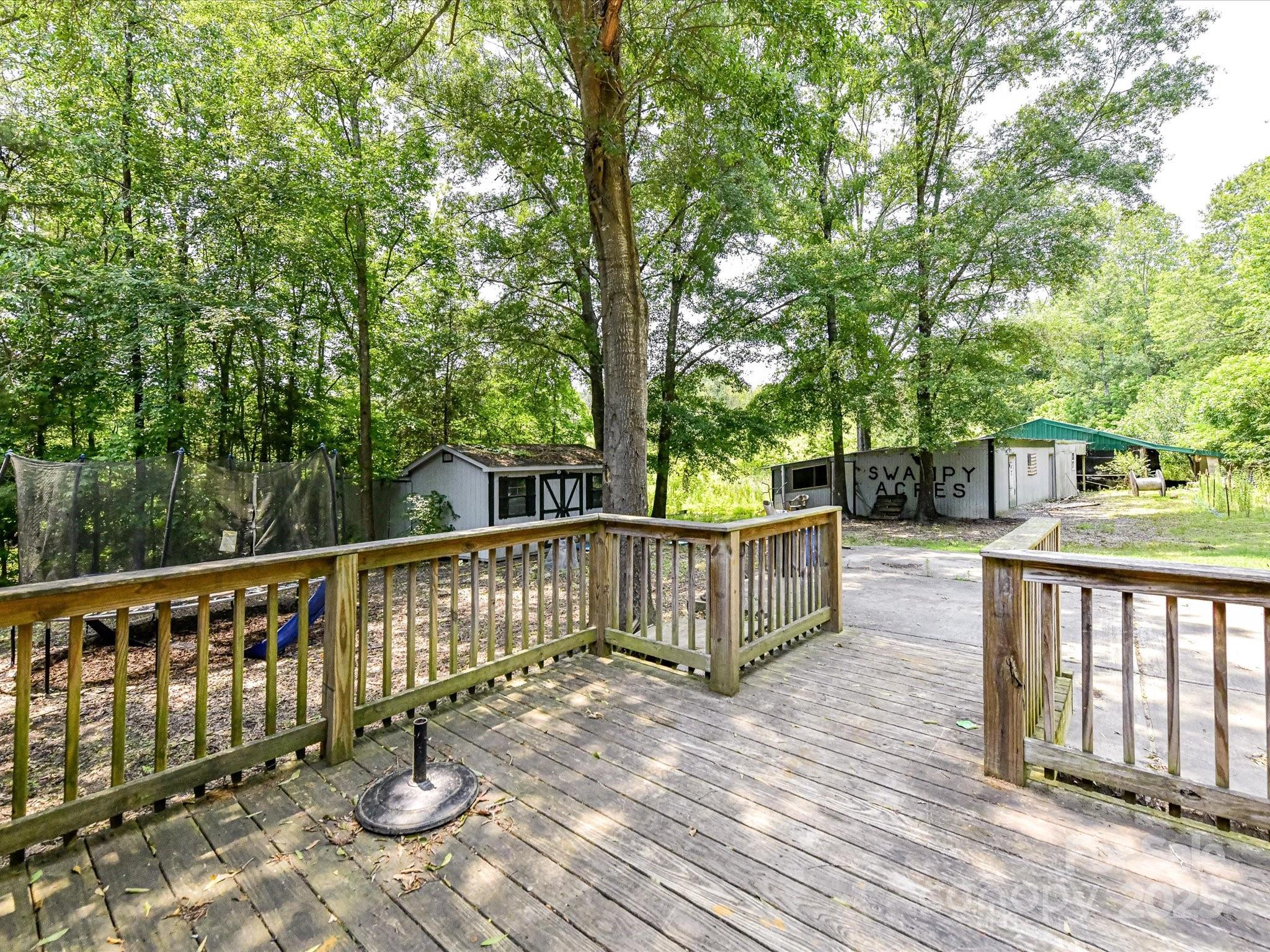 615 Hawley Road McConnells, SC 29726 - Photo 25 of 47 a view of a deck with two chair and wooden floor