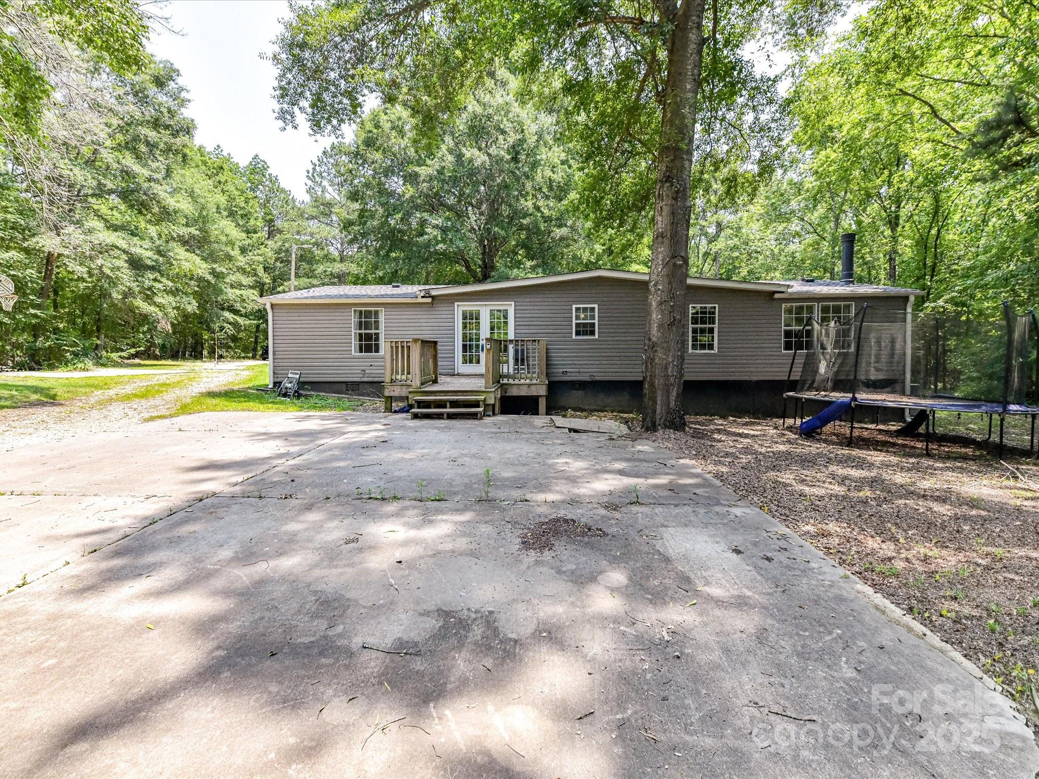615 Hawley Road McConnells, SC 29726 - Photo 29 of 47 a view of a house with backyard and trees