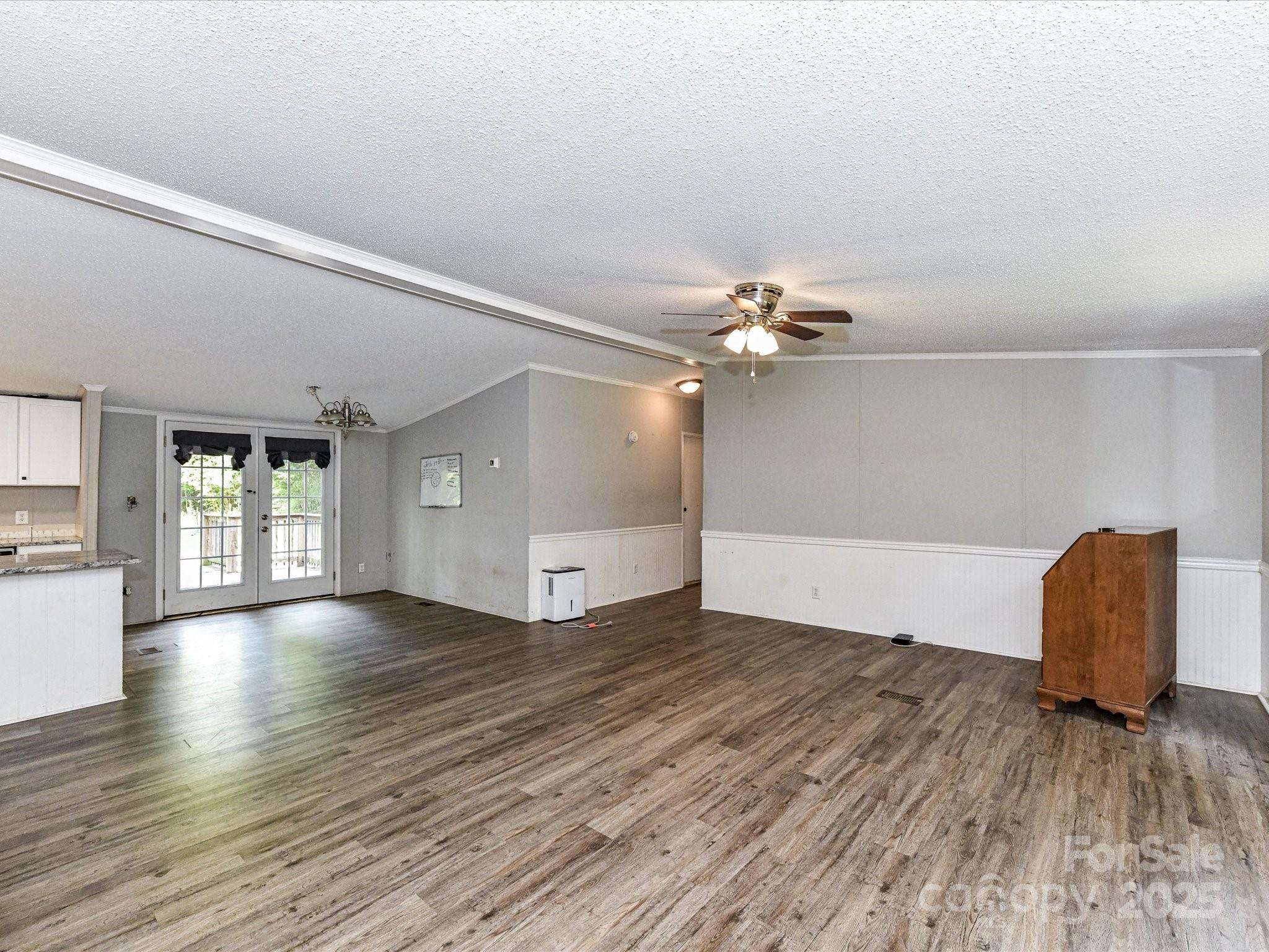 615 Hawley Road McConnells, SC 29726 - Photo 7 of 47 a view of an empty room with window and wooden floor