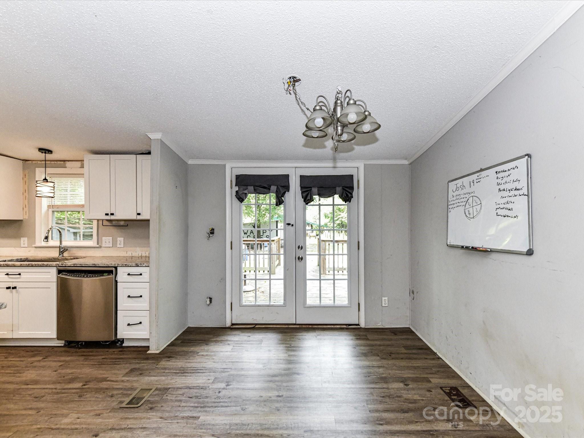 615 Hawley Road McConnells, SC 29726 - Photo 8 of 47 a view of a kitchen with a sink dishwasher and wooden floor