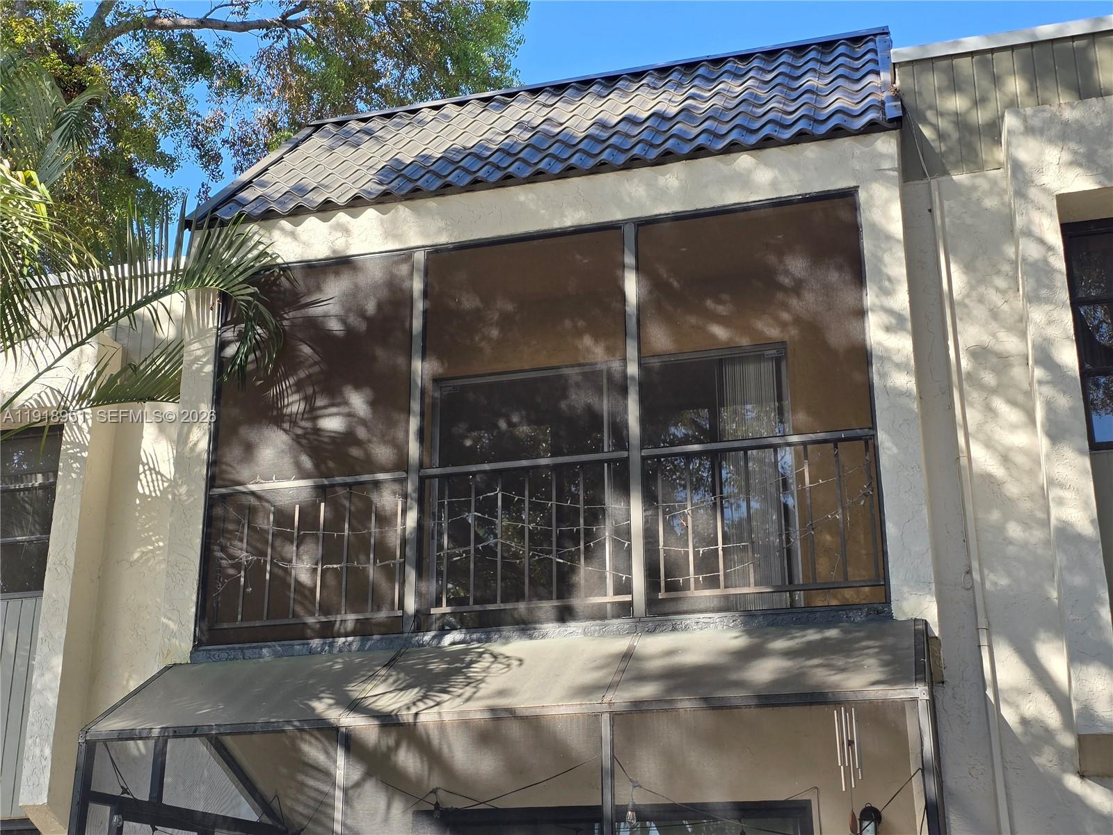 7925 Southwest 104th Street, Unit 201E Miami, FL 33156 - Photo 2 of 32 a view of fountain in the front of house