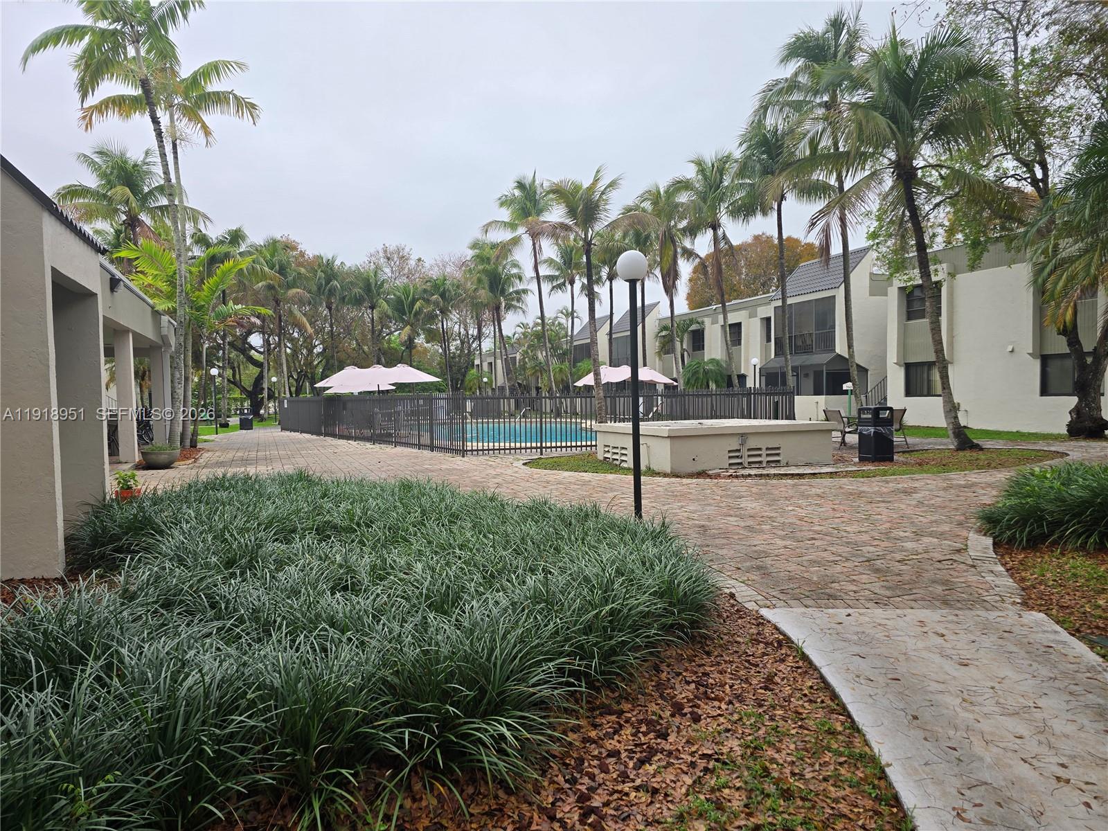 7925 Southwest 104th Street, Unit 201E Miami, FL 33156 - Photo 7 of 32 a view of a yard and entertaining space
