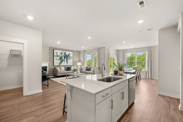 a kitchen with white cabinets and white appliances